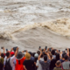 A shocking video circulating on social media captures the moment a large group of tourists in China was swept away